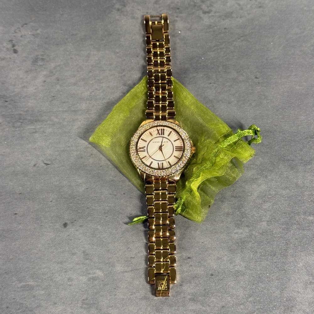 Anne Klein Watch AK/1430 Gold Tone Crystal Bezel Mother of Pearl Dial‎ Womens